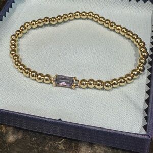 Gold Beaded Bracelet with Purple Gemstone